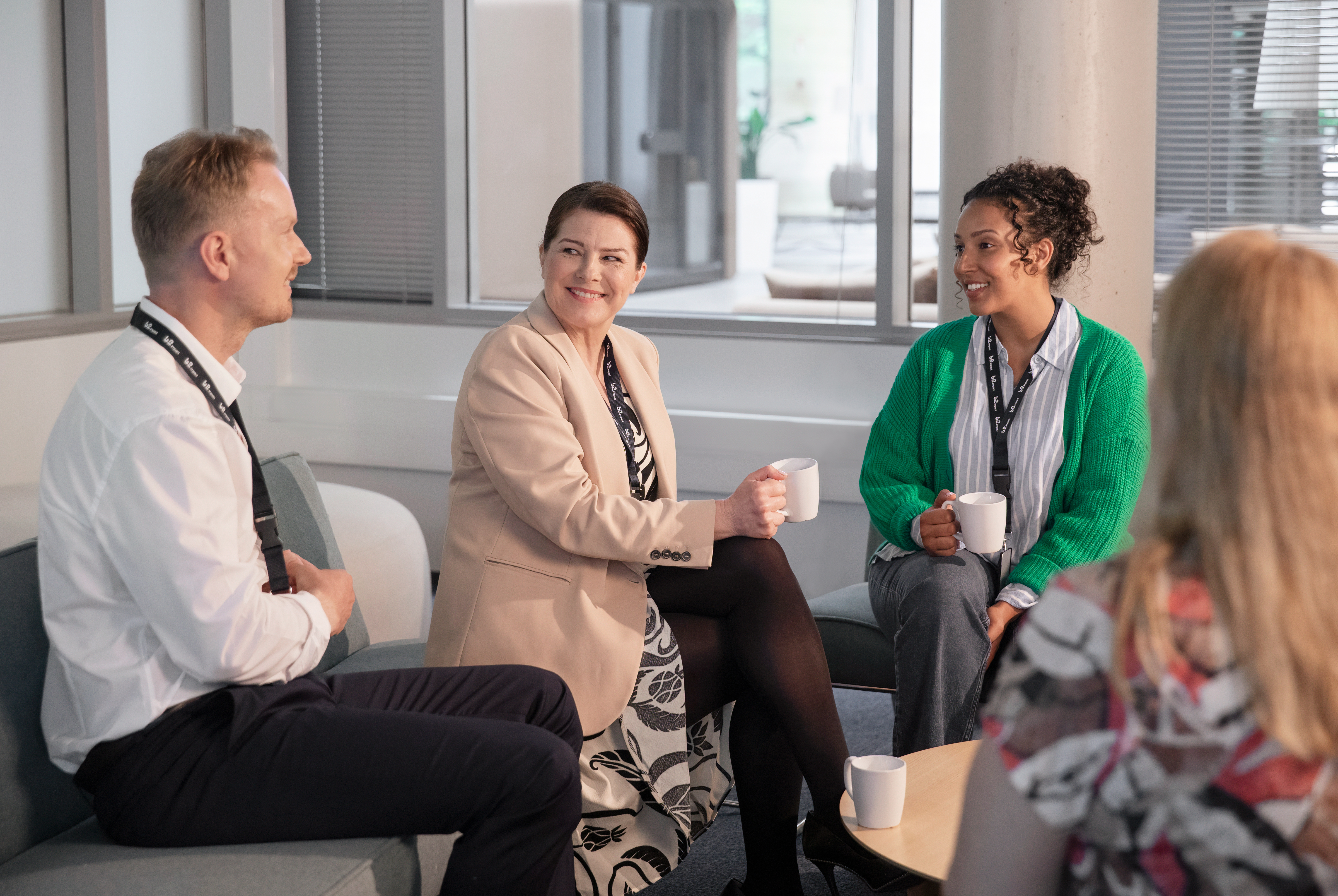 Two women and a man in an office