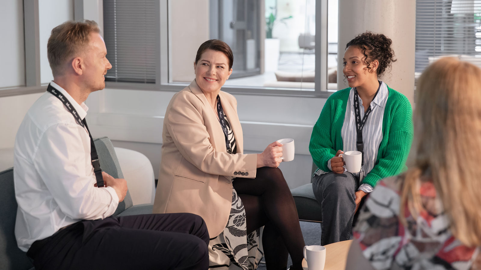 Two women and a man in an office
